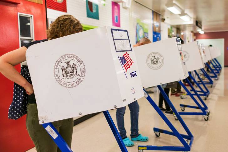Voting inside a school cafeteria during the mayoral primary election last year. Money in politics has grown even more present in elections across the U.S.